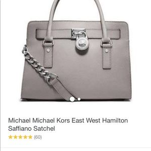 Micheal Kors. A beautiful gray with silver satchel